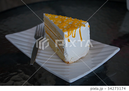 Cake on the white dish. 34273174