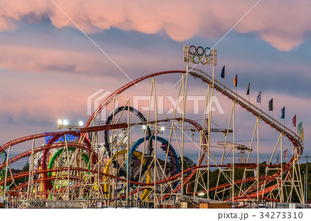 View of rollercoaster in Oktoberfest during sunset View of rollercoaster in Oktoberfest during sunset 34273310