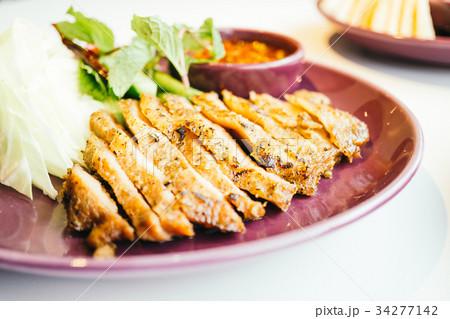 Grilled pork neck meat with spicy sauce 34277142