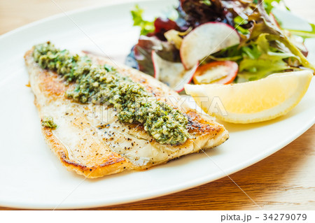 Grilled sea bass fish meat steak with vegetable 34279079