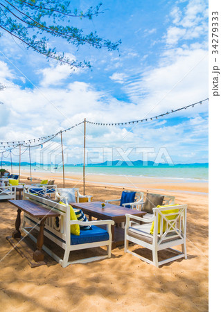 Chair and table dinning on the beach and sea with blue sky 34279333