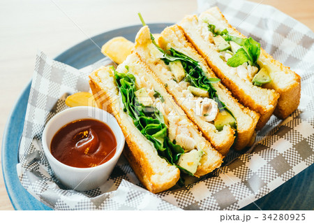 Sandwich with avocado and chicken meat with french fries Sandwich with avocado and chicken meat with french fries 34280925