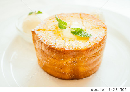 French toast bread with butter on top and ice cream French toast bread with butter on top and ice cream 34284505