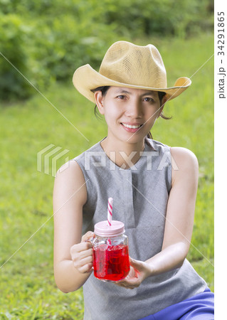 Portraits Asian Woman with a pitcher in hand. Portraits Asian Woman with a pitcher in hand. 34291865