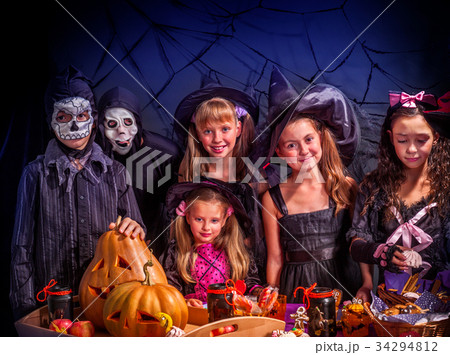 Halloween kids holding carved pumpkin . Halloween kids holding carved pumpkin . 34294812