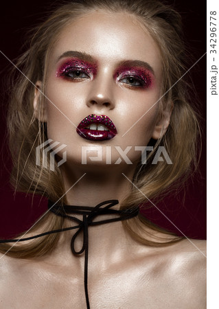 Beautiful girl with creative bright makeup with 34296778
