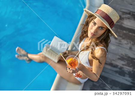 Model near swimming pool outdoors 34297091