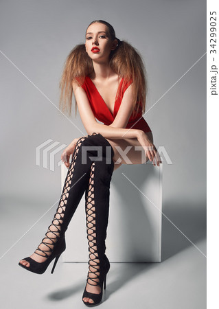 Portrait of sexual woman in dress and boots 34299025