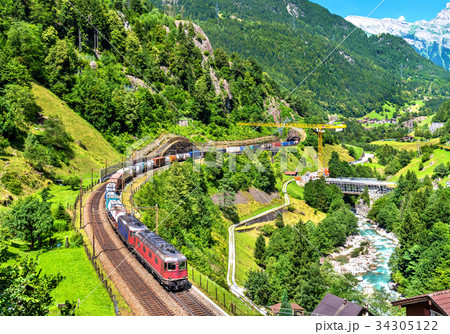 Freight train climbs up the Gotthard railway - 34305122