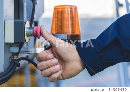 Man finger pushing rubber knob Man finger pushing rubber knob 34306430