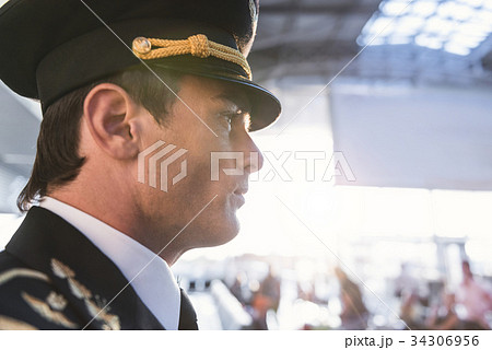 Serene aviator situating at airport 34306956