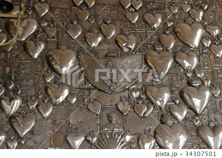 Metal hearts in the church Ostra Brama. Vilnius. Metal hearts in the church Ostra Brama. Vilnius. 34307501