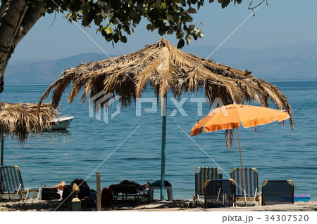 parasols and sunbeds on the beach parasols and sunbeds on the beach 34307520