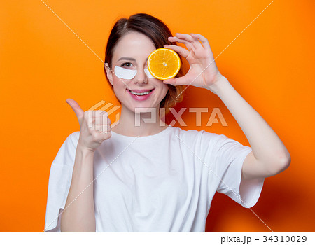 Woman using eye patch for her eyes Woman using eye patch for her eyes 34310029
