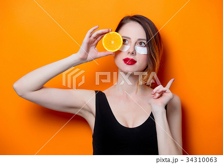 Woman using eye patch for her eyes 34310063