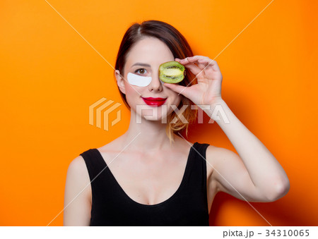 Woman using eye patch for her eyes 34310065