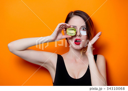 Woman using eye patch for her eyes 34310068