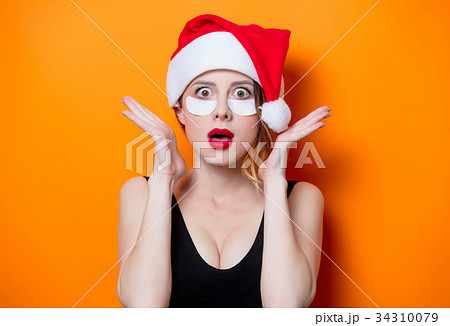 Woman using eye patch for her eyes Woman using eye patch for her eyes 34310079