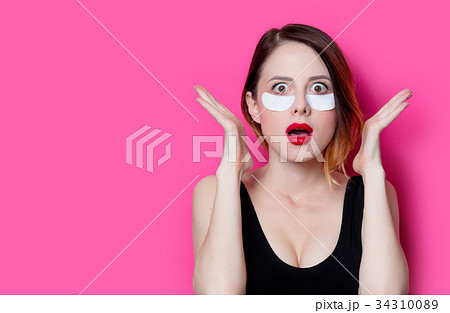 Woman using eye patch for her eyes 34310089