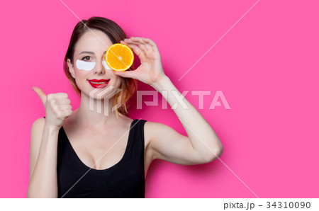 Woman using eye patch for her eyes 34310090