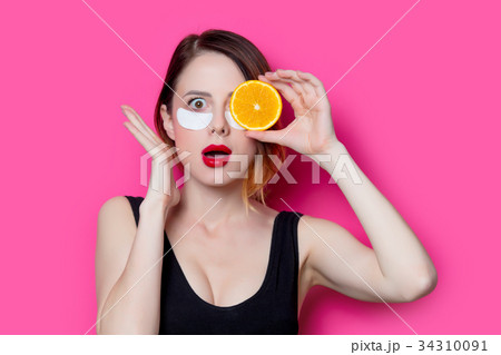 Woman using eye patch for her eyes 34310091