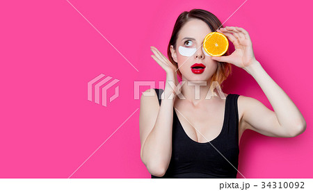 Woman using eye patch for her eyes 34310092