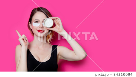 Woman using eye patch for her eyes  34310094