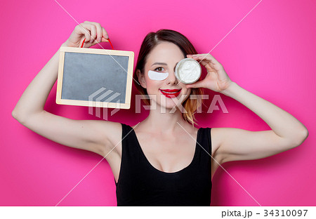 Woman using eye patch for her eyes 34310097