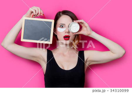 Woman using eye patch for her eyes 34310099
