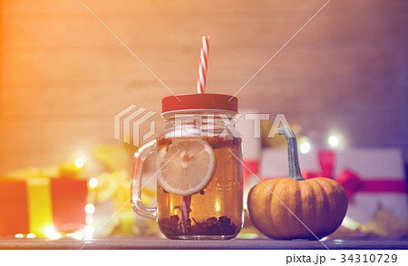 leaves and pumpkin with Halloween gift box and Tea 34310729
