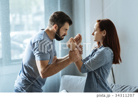 Angry strong man losing control over his emotions 34311207