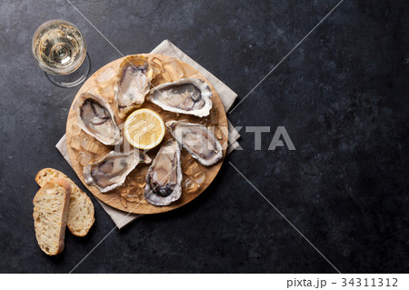 Oysters and wine Oysters and wine 34311312