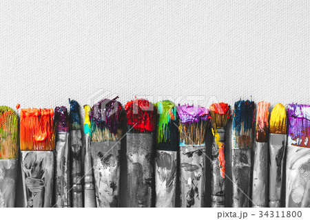 Row of artist paintbrushes with colorful bristle Row of artist paintbrushes with colorful bristle 34311800