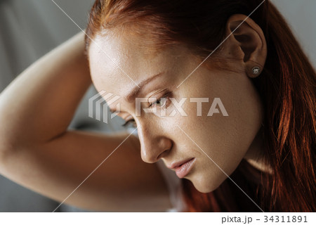 Portrait of a beautiful sad woman 34311891