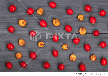 Hawthorn berry on a black wooden background. top Hawthorn berry on a black wooden background. top 34312783