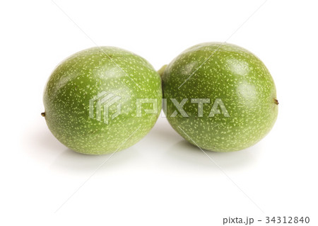 fresh walnuts in peel isolated on white background fresh walnuts in peel isolated on white background 34312840