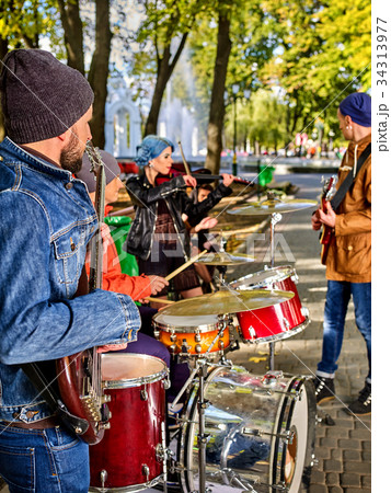 Festival music band. Friends playing on percussion Festival music band. Friends playing on percussion 34313977