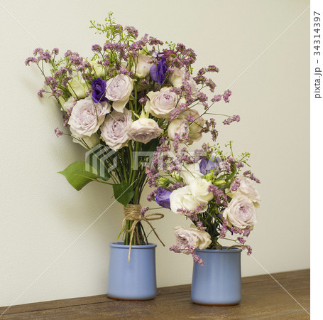 Purple and pink flower bouquet on white background 34314397