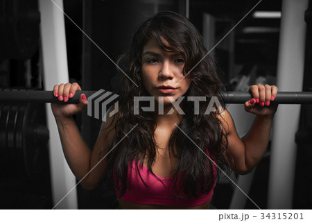 Woman holding barbell Woman holding barbell 34315201