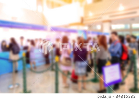 blur people at queue in front of exhibition gate blur people at queue in front of exhibition gate 34315535