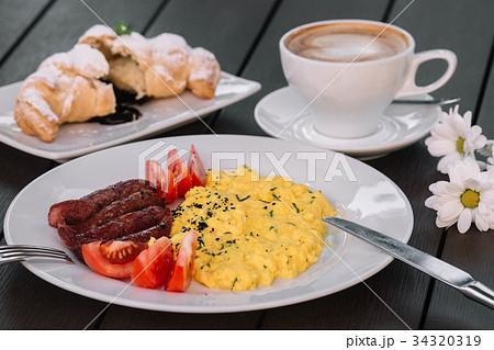 Breakfast with scrambled eggs Breakfast with scrambled eggs 34320319