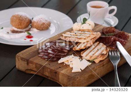 Breakfast with toasts and salami Breakfast with toasts and salami 34320320