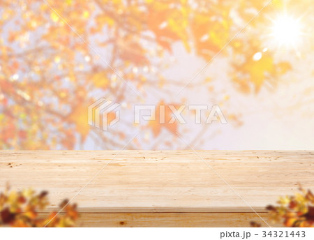 Empty wood table with blur maple leaf with sun 34321443