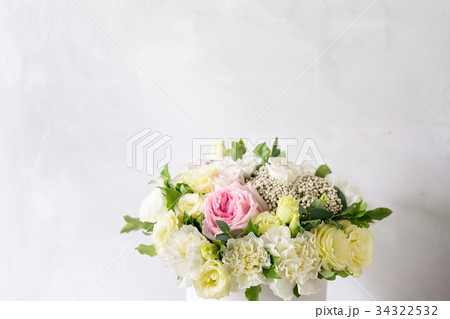 Beautiful tender bouquet of flowers in white box Beautiful tender bouquet of flowers in white box 34322532