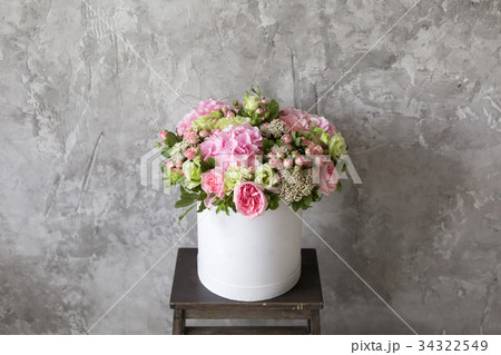 Beautiful tender bouquet of flowers in white box Beautiful tender bouquet of flowers in white box 34322549