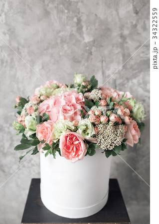 Beautiful tender bouquet of flowers in white box 34322559