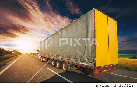Truck on the road driving along the asphalt road 34323118