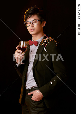 Enjoying wine at the party 34323770