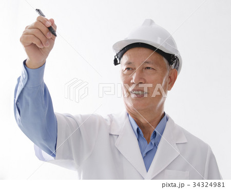 Asian senior architect writing on blank space Asian senior architect writing on blank space 34324981