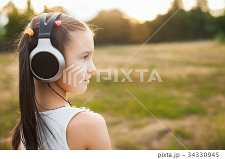 cute child with headphones listening music cute child with headphones listening music 34330945